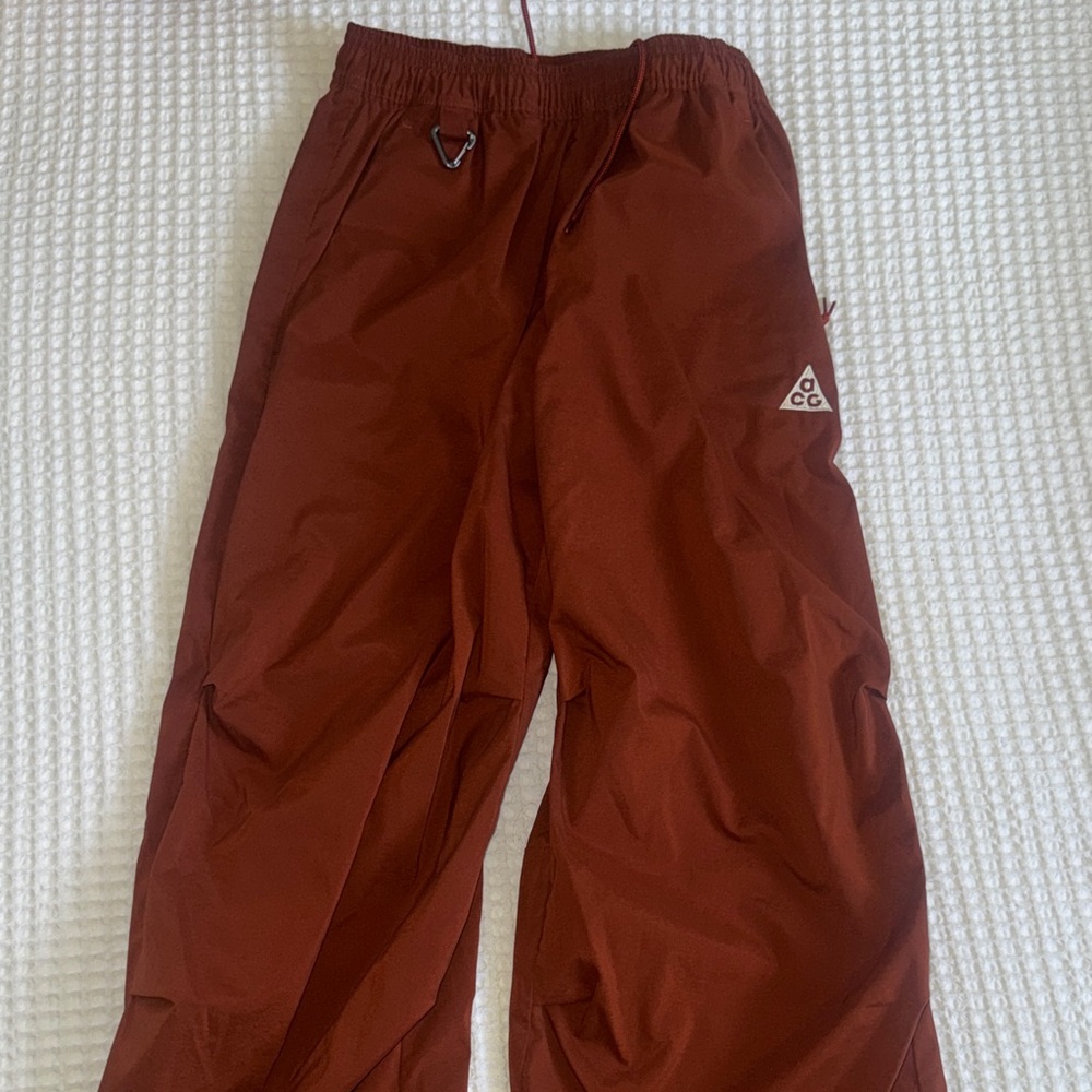 Nike ACG women’s Rust Red bomber pants